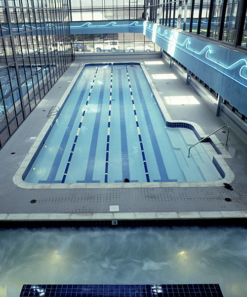 The neon waves artfully accent this quality lap pool in a Denver, Colorado health club.