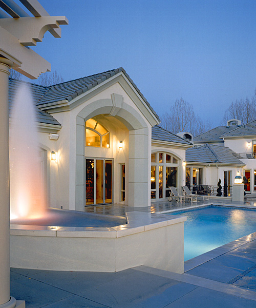 Formal swimming pools can incoprporate fountains, decorative columns and led lighting efftects.