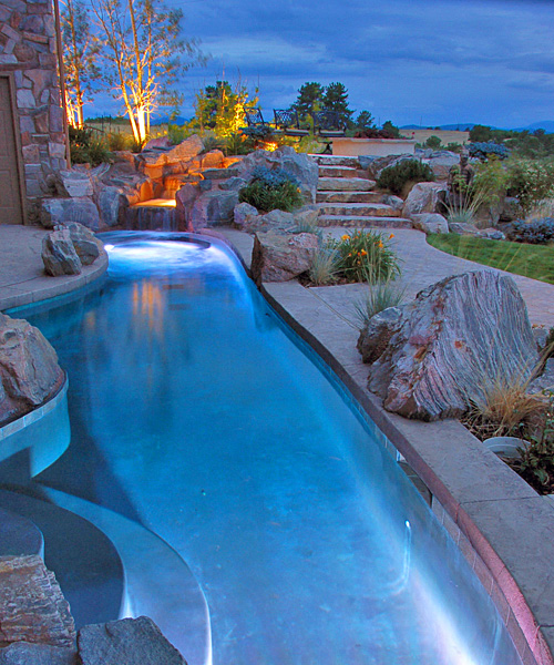 Formal swimming pools can incoprporate fountains, decorative columns and led lighting efftects.